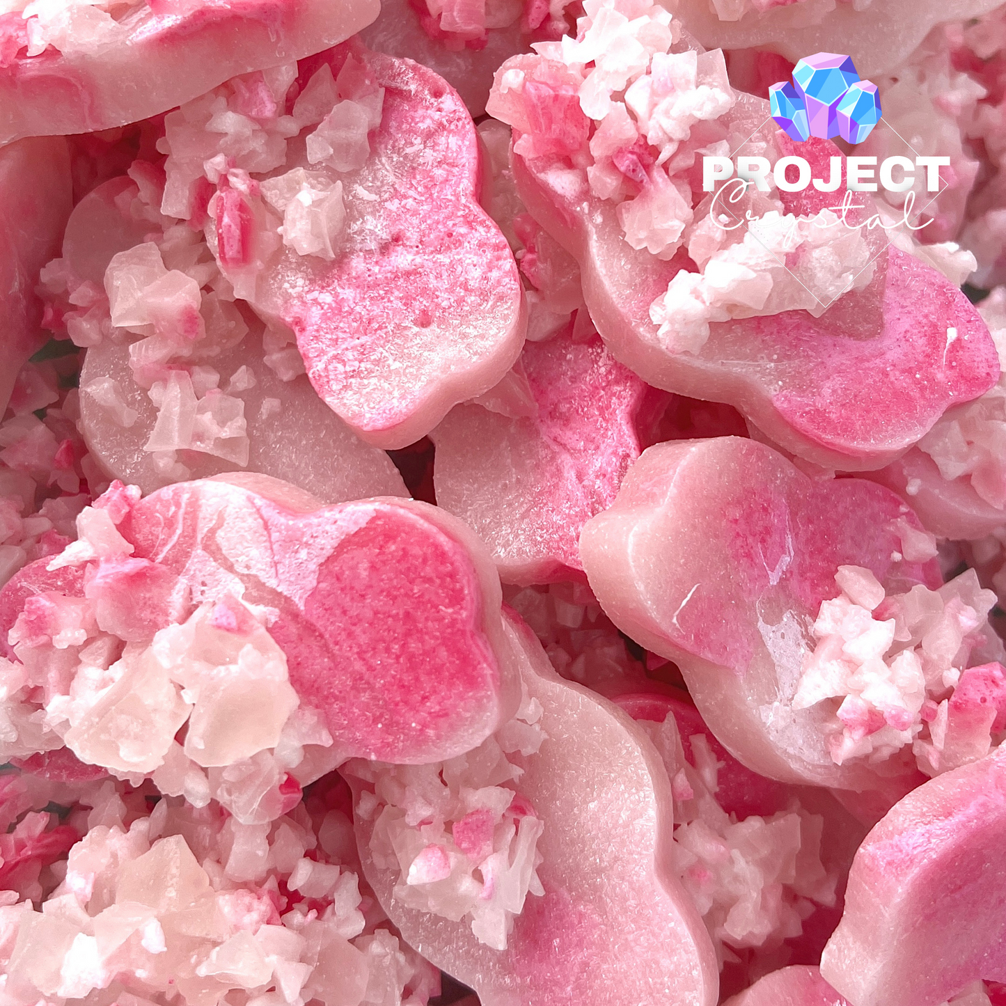 A selection of toasted marshmallow edible crystals, pretty shades of pink in fluffy cloud shapes 
